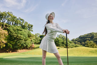FAIRLIAR 26SS editorial - white pleated golf skirt with knit jacket and lace bucket hat